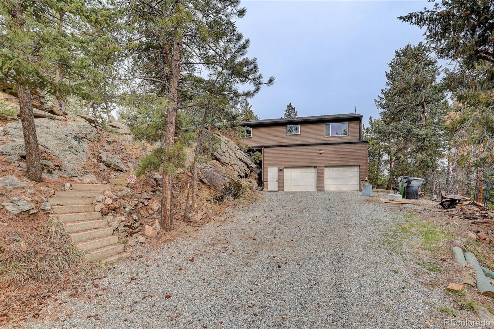 27857 Apex Circle Evergreen, CO 80439 - Photo 32 of 37 a big room with trees in front of it