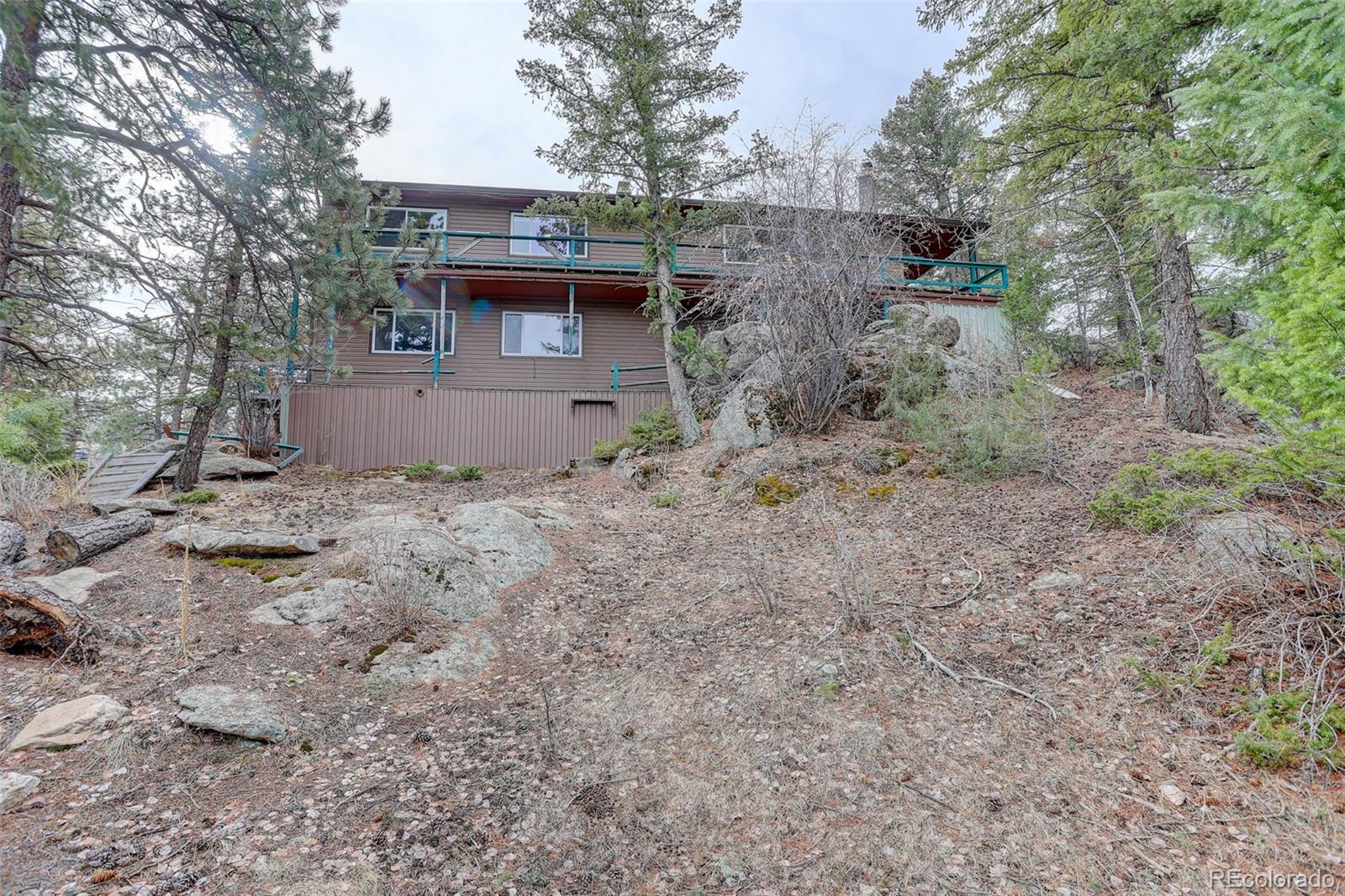 27857 Apex Circle Evergreen, CO 80439 - Photo 33 of 37 a view of a house with a yard