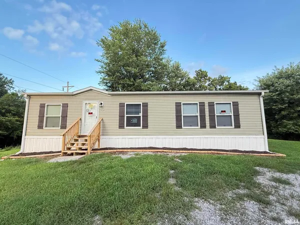 a front view of house with yard and seating
