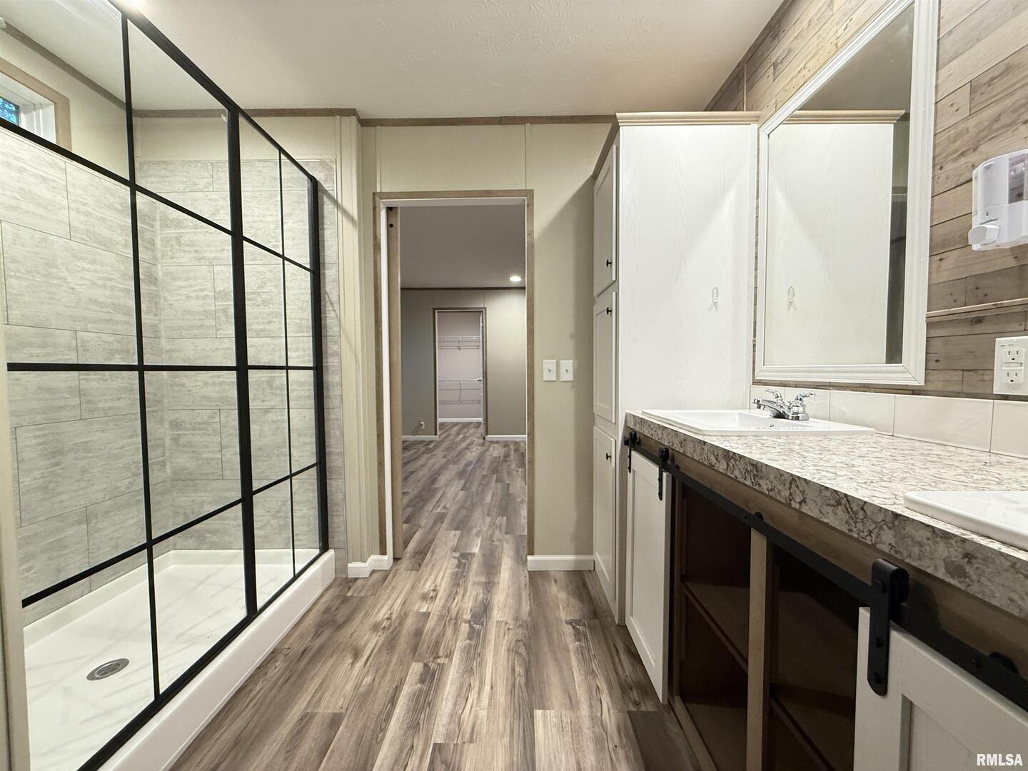 9049 Grassy Road Marion, IL 62959 - Photo 18 of 45 a bathroom with a granite countertop sink and a mirror
