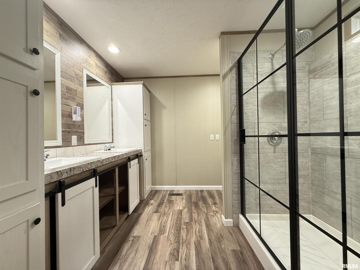 9049 Grassy Road Marion, IL 62959 - Photo 19 of 45 a spacious bathroom with a granite countertop sink and a mirror