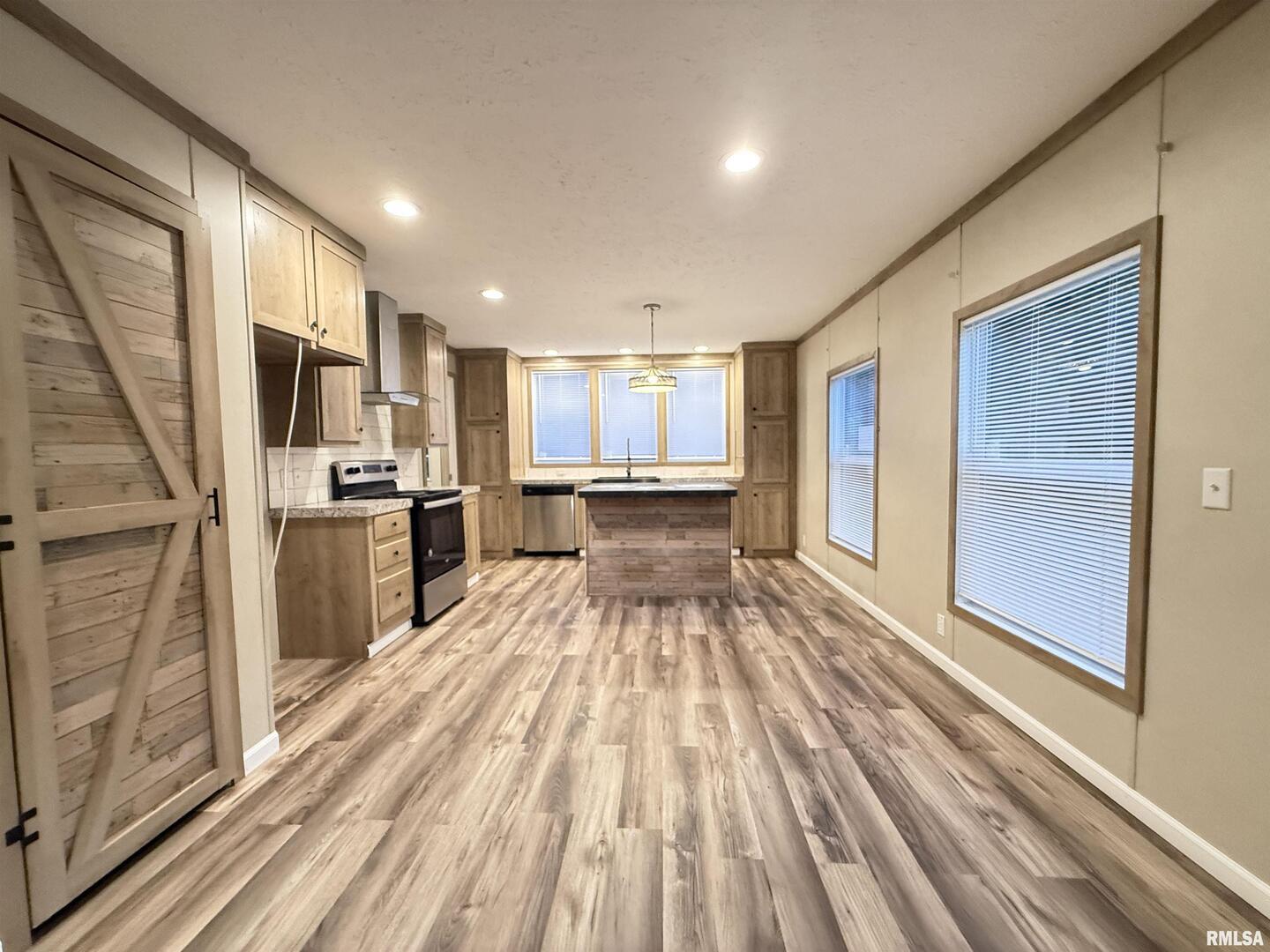 9049 Grassy Road Marion, IL 62959 - Photo 2 of 45 a view of a kitchen with wooden floor electronic appliances and windows