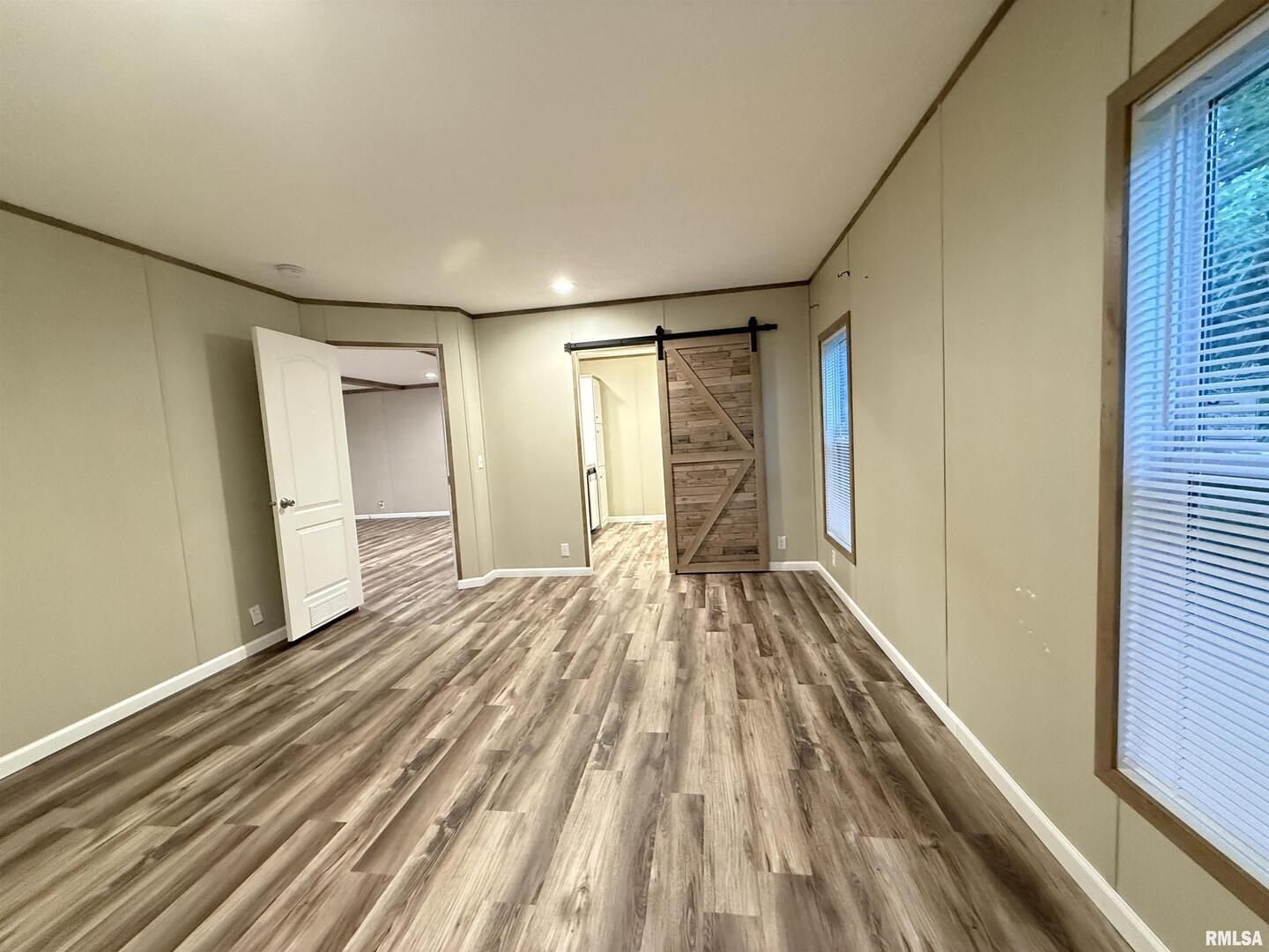 9049 Grassy Road Marion, IL 62959 - Photo 22 of 45 a view of empty room with wooden floor