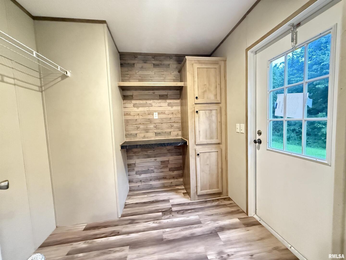 9049 Grassy Road Marion, IL 62959 - Photo 31 of 45 a view of front door with wooden floor