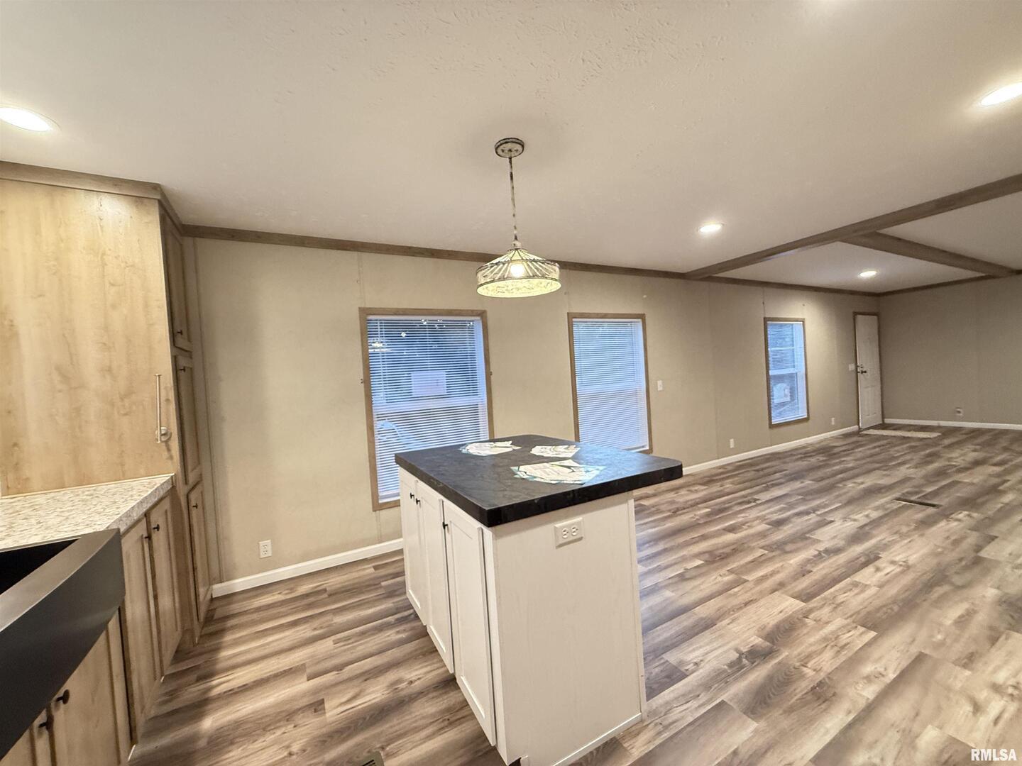 9049 Grassy Road Marion, IL 62959 - Photo 4 of 45 a kitchen with stainless steel appliances granite countertop a sink and a refrigerator