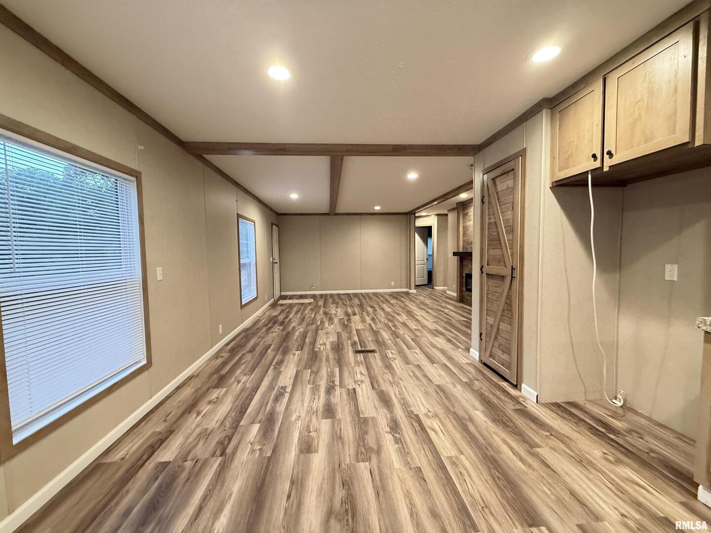9049 Grassy Road Marion, IL 62959 - Photo 5 of 45 a view of a hallway with wooden floor