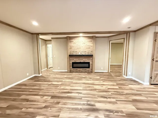 a view of an empty room with a fireplace