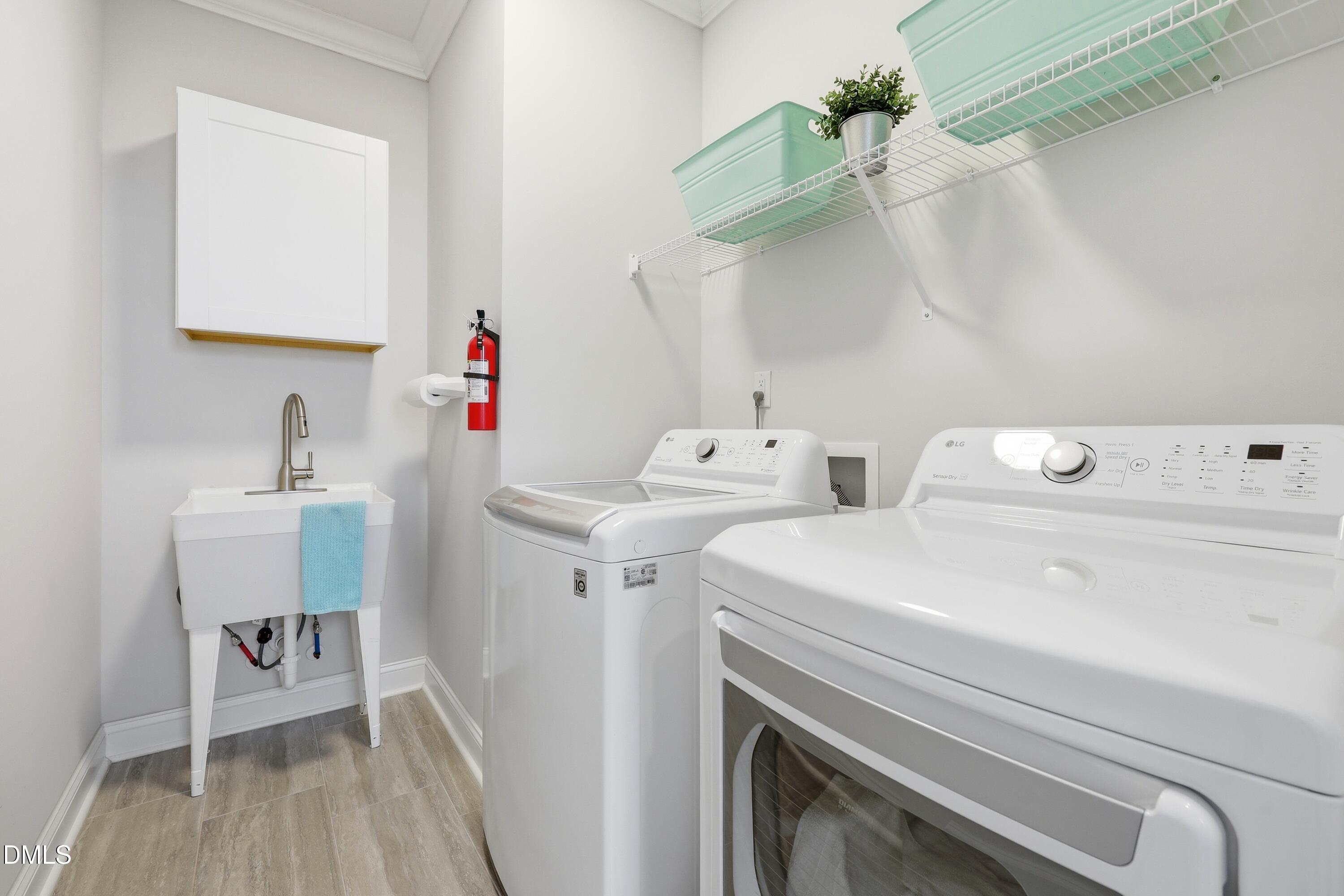 289 English Violet Lane Raleigh, NC 27610 - Photo 26 of 40 a utility room with dryer and washer
