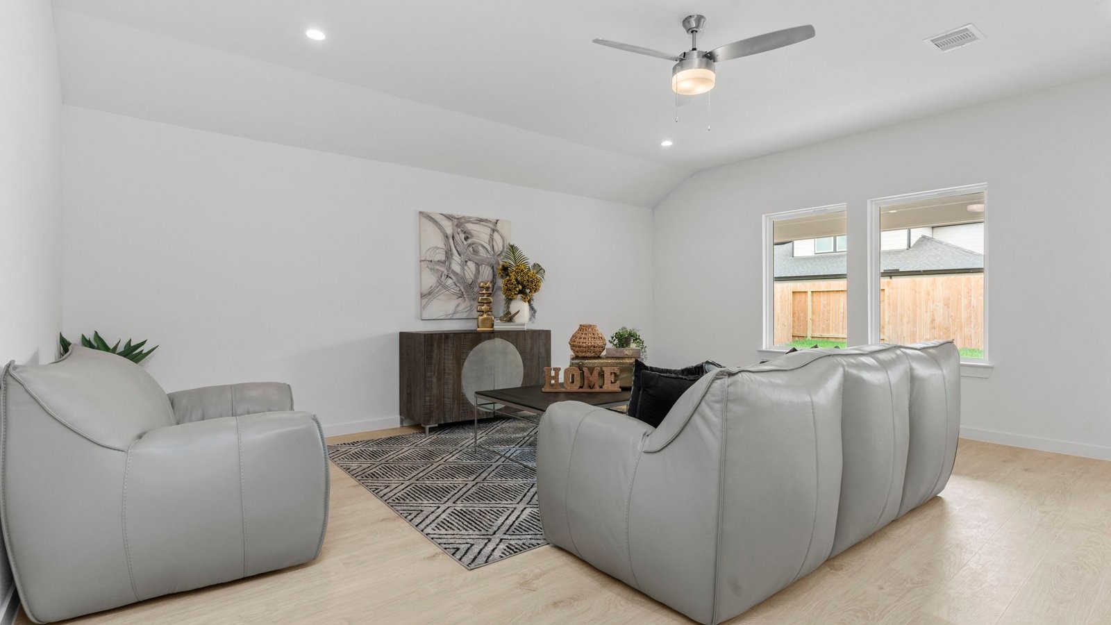 31306 Mila Cove Fulshear, TX 77441 - Photo 13 of 48 a living room with furniture and a window
