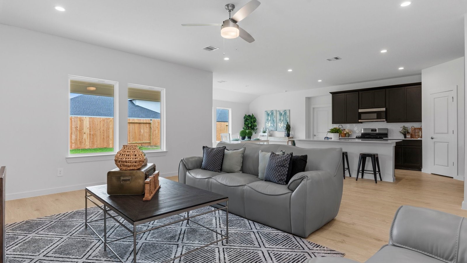 31306 Mila Cove Fulshear, TX 77441 - Photo 15 of 48 a living room with furniture and a flat screen tv