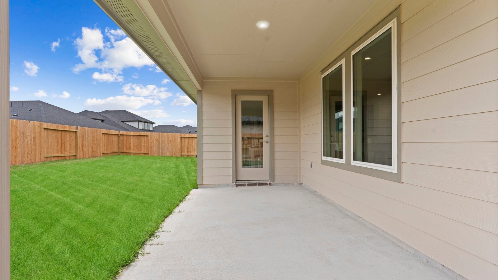 31306 Mila Cove Fulshear, TX 77441 - Photo 28 of 48 a view of a backyard with a garden