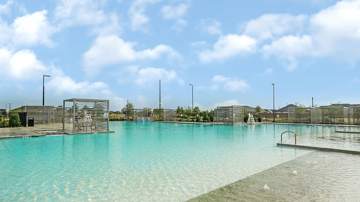 31306 Mila Cove Fulshear, TX 77441 - Photo 42 of 48 a view of a lake with boats in front of it