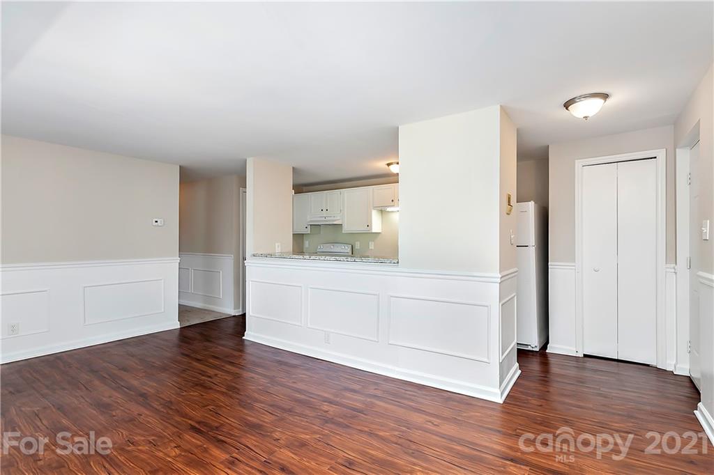9405 Old Concord Road, Unit J Charlotte, NC 28213 - Photo 2 of 15 a view of empty room with wooden floor