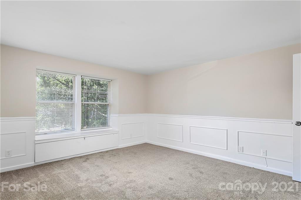 9405 Old Concord Road, Unit J Charlotte, NC 28213 - Photo 11 of 15 a view of an empty room with a window