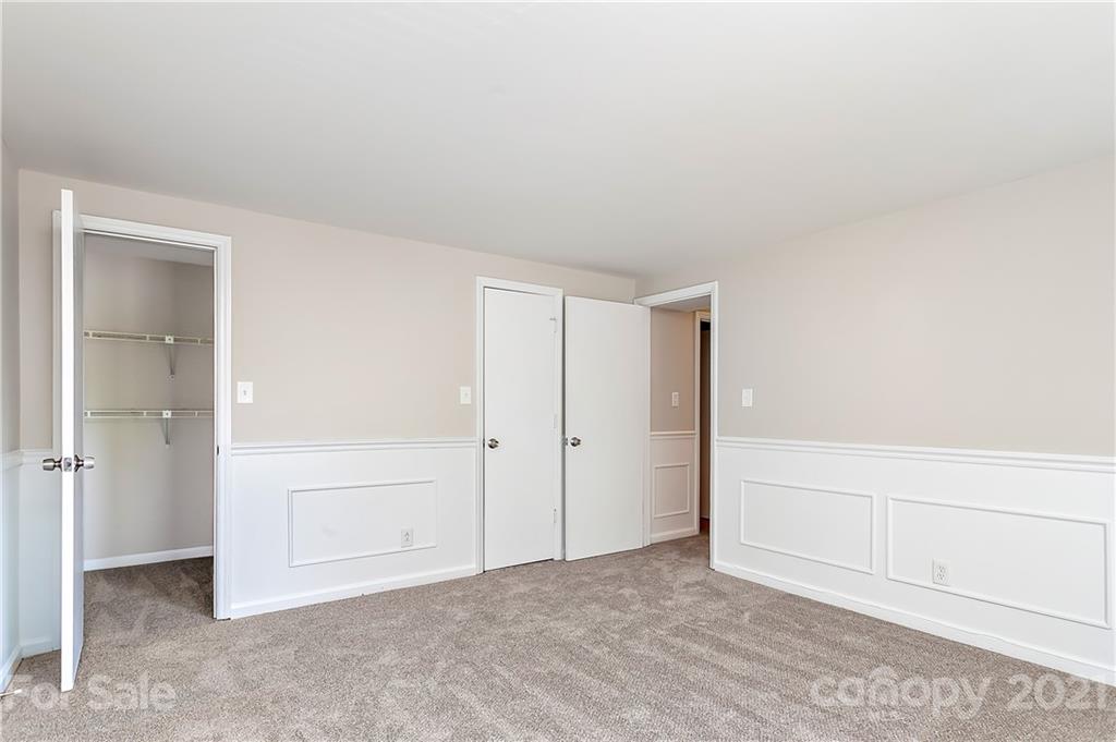 9405 Old Concord Road, Unit J Charlotte, NC 28213 - Photo 12 of 15 an empty room with closet area