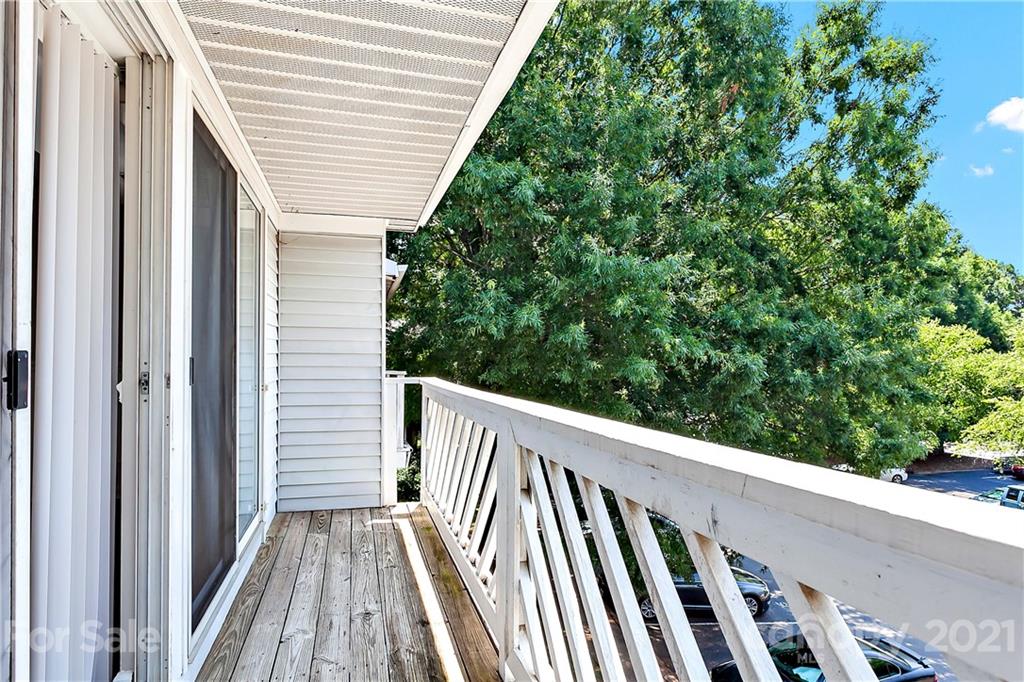 9405 Old Concord Road, Unit J Charlotte, NC 28213 - Photo 13 of 15 a view of balcony with wooden floor