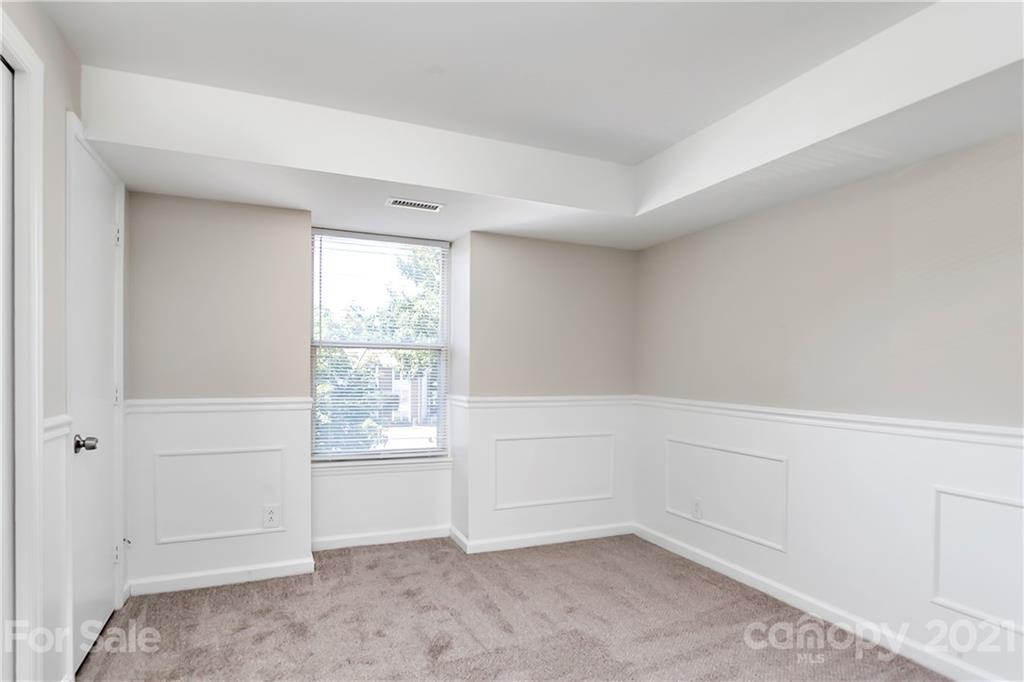 9405 Old Concord Road, Unit J Charlotte, NC 28213 - Photo 8 of 15 a view of an empty room with a window