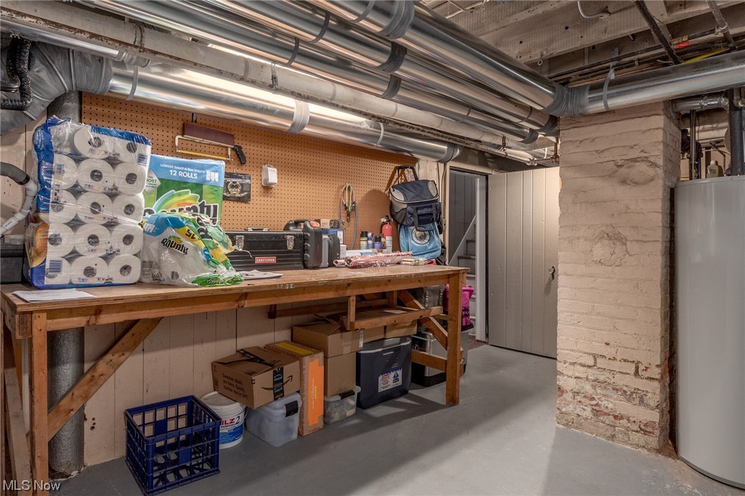 2482 Charney Road Cleveland, OH 44118 - Photo 31 of 34 Basement with gas water heater and a workshop area