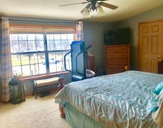 60 Mill Street Rimersburg, PA 16248 - Photo 13 of 17 a bedroom with a bed and a chandelier