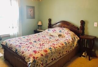 60 Mill Street Rimersburg, PA 16248 - Photo 17 of 17 a bed sitting in a bedroom next to a window