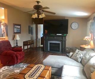 60 Mill Street Rimersburg, PA 16248 - Photo 3 of 17 a living room with furniture a fireplace and a flat screen tv