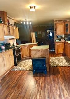 60 Mill Street Rimersburg, PA 16248 - Photo 6 of 17 a kitchen with stainless steel appliances granite countertop a stove top oven and cabinets