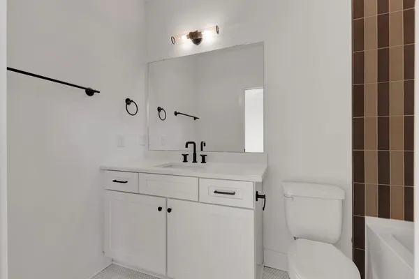 a bathroom with a bathtub and shower