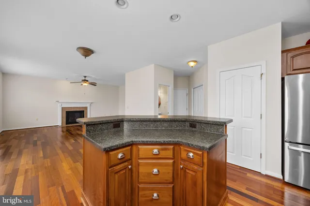 a living room with furniture a fireplace and a table