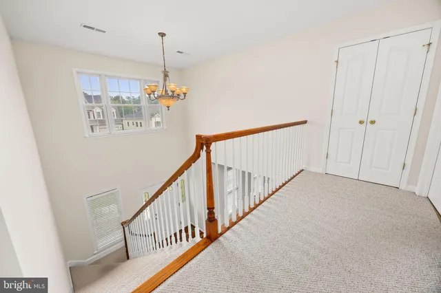 a spacious bathroom with a double vanity sink a mirror and a shower