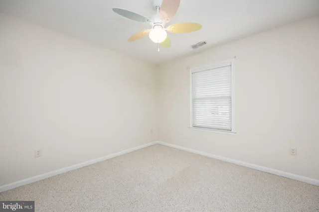 a view of room with furniture and a window