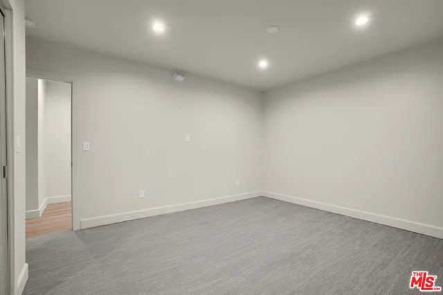a view of balcony with wooden floor