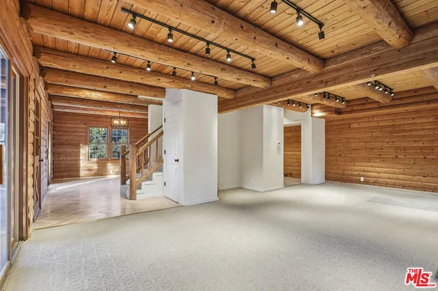 a view of a room with a kitchen