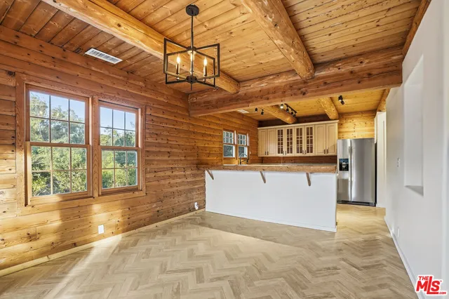 a kitchen with stainless steel appliances granite countertop a stove and a sink
