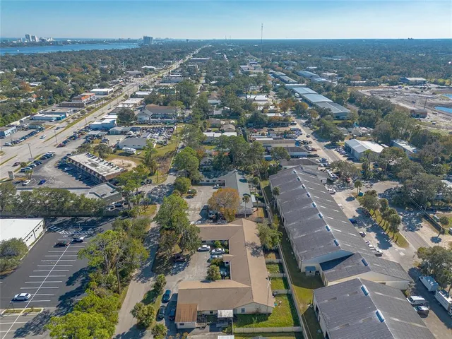 an aerial view of residential building and lake