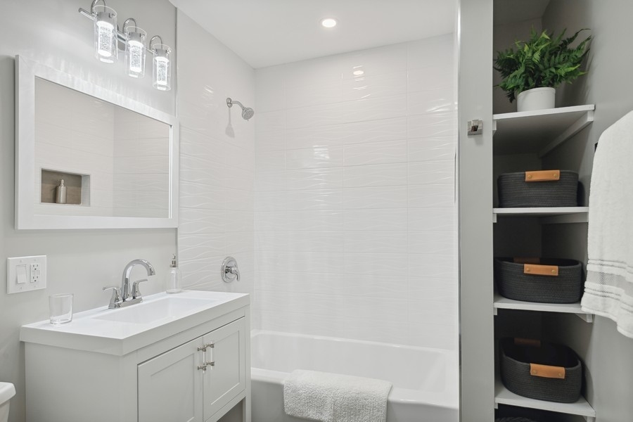 304 Walnut Street Elmhurst, IL 60126 - Photo 8 of 15 a bathroom with a sink a toilet and vanity