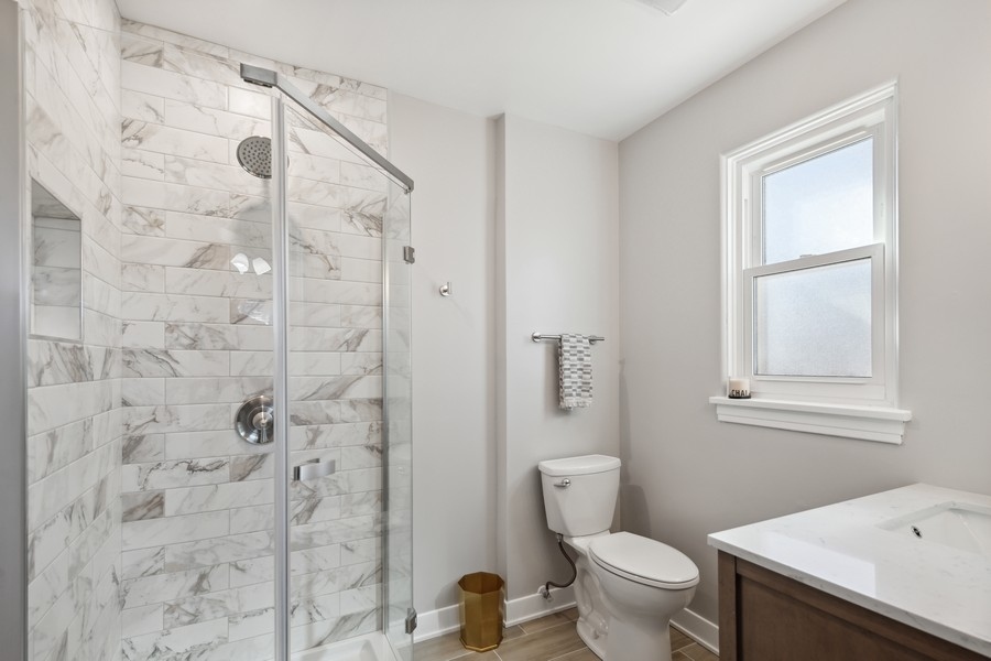 304 Walnut Street Elmhurst, IL 60126 - Photo 10 of 15 a white toilet sitting next to a bathroom sink