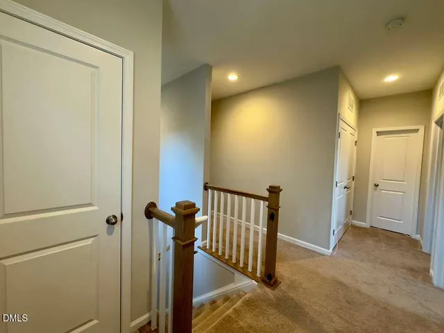a view of a hallway with closet area