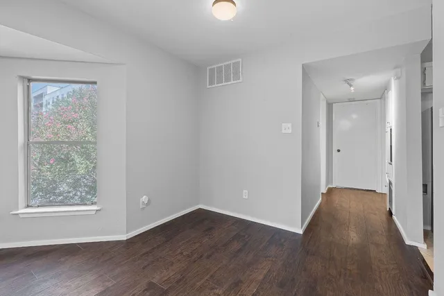 a kitchen with sink a stove and cabinets