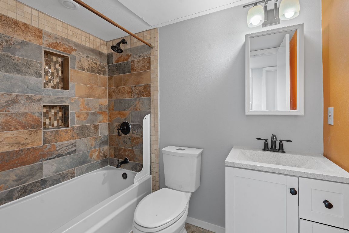 2104 Cullen Avenue, Unit 4224 Austin, TX 78757 - Photo 18 of 24 a bathroom with a sink toilet and shower