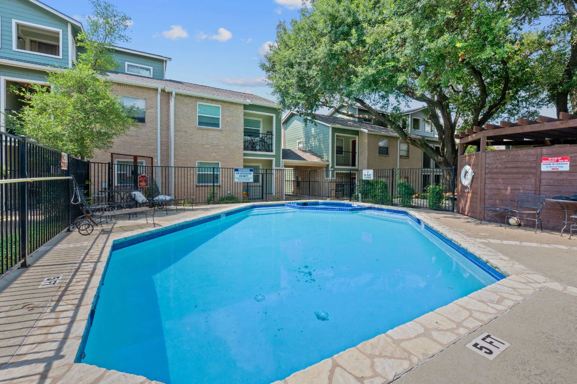 2104 Cullen Avenue, Unit 4224 Austin, TX 78757 - Photo 23 of 24 a view of a house with swimming pool