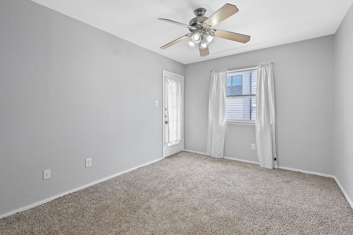2104 Cullen Avenue, Unit 4224 Austin, TX 78757 - Photo 4 of 24 a view of an empty room with a chandelier fan