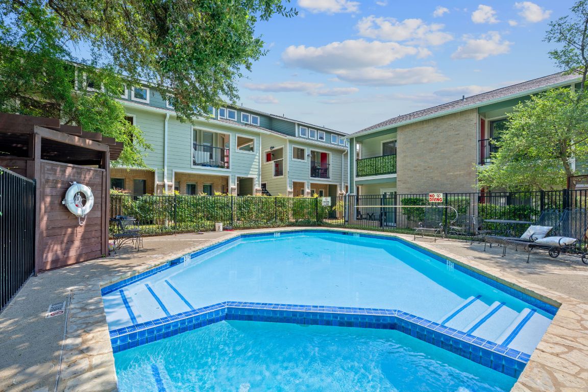 2104 Cullen Avenue, Unit 4224 Austin, TX 78757 - Photo 5 of 24 a view of swimming pool with lawn chairs and plants