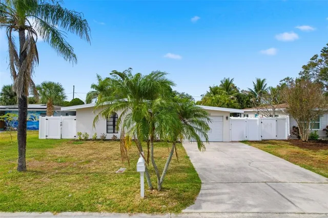 a view of room with a ceiling fan and window