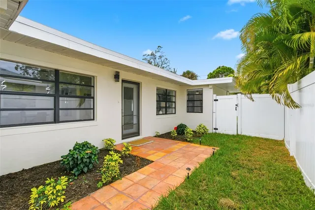 a bathroom with a bathtub and a shelf