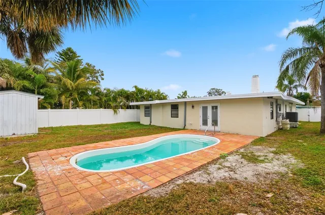 a bedroom with a large bed and a flat screen tv
