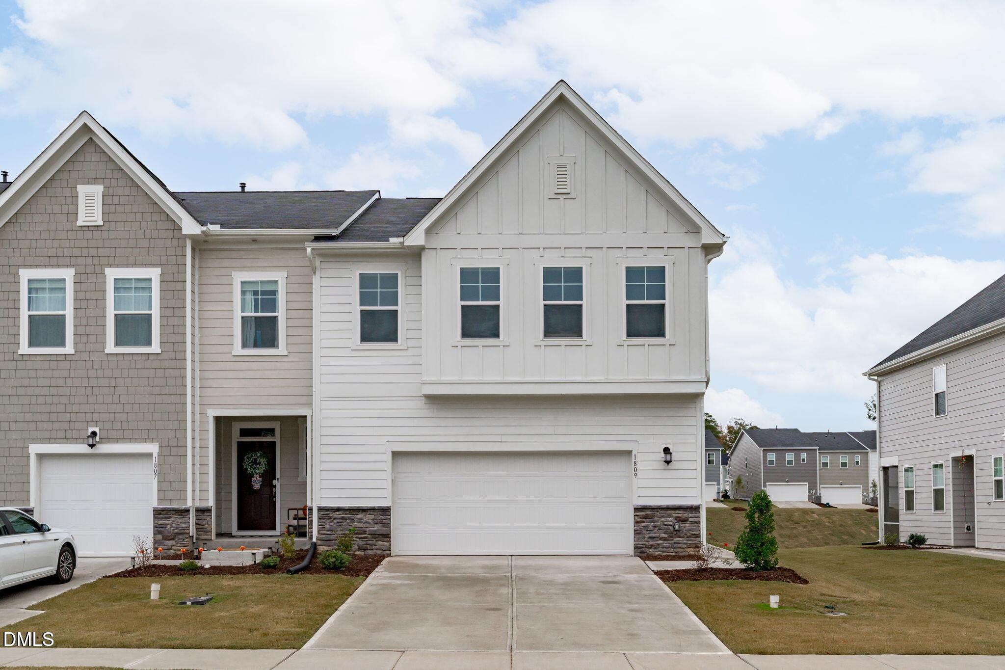 a front view of a house with yard