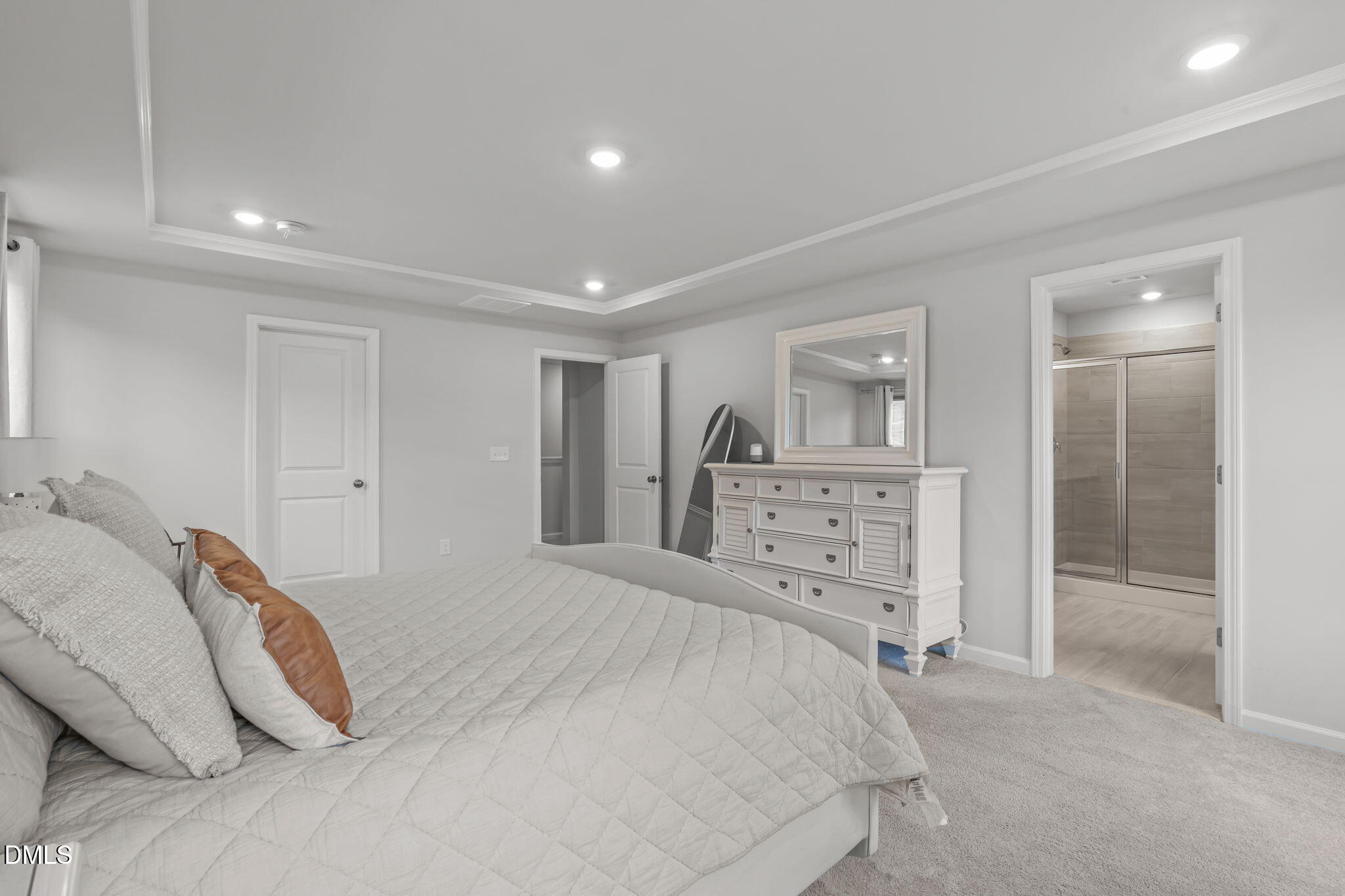 1809 Barrett Run Trail Apex, NC 27502 - Photo 14 of 23 a spacious bedroom with a bed and a walk in closet