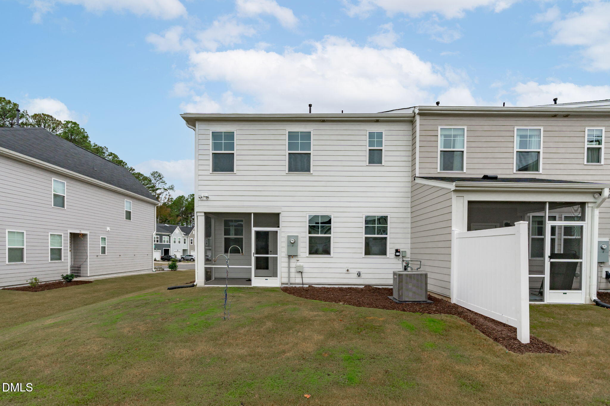 1809 Barrett Run Trail Apex, NC 27502 - Photo 23 of 23 front view of a house with a lots of windows and plants