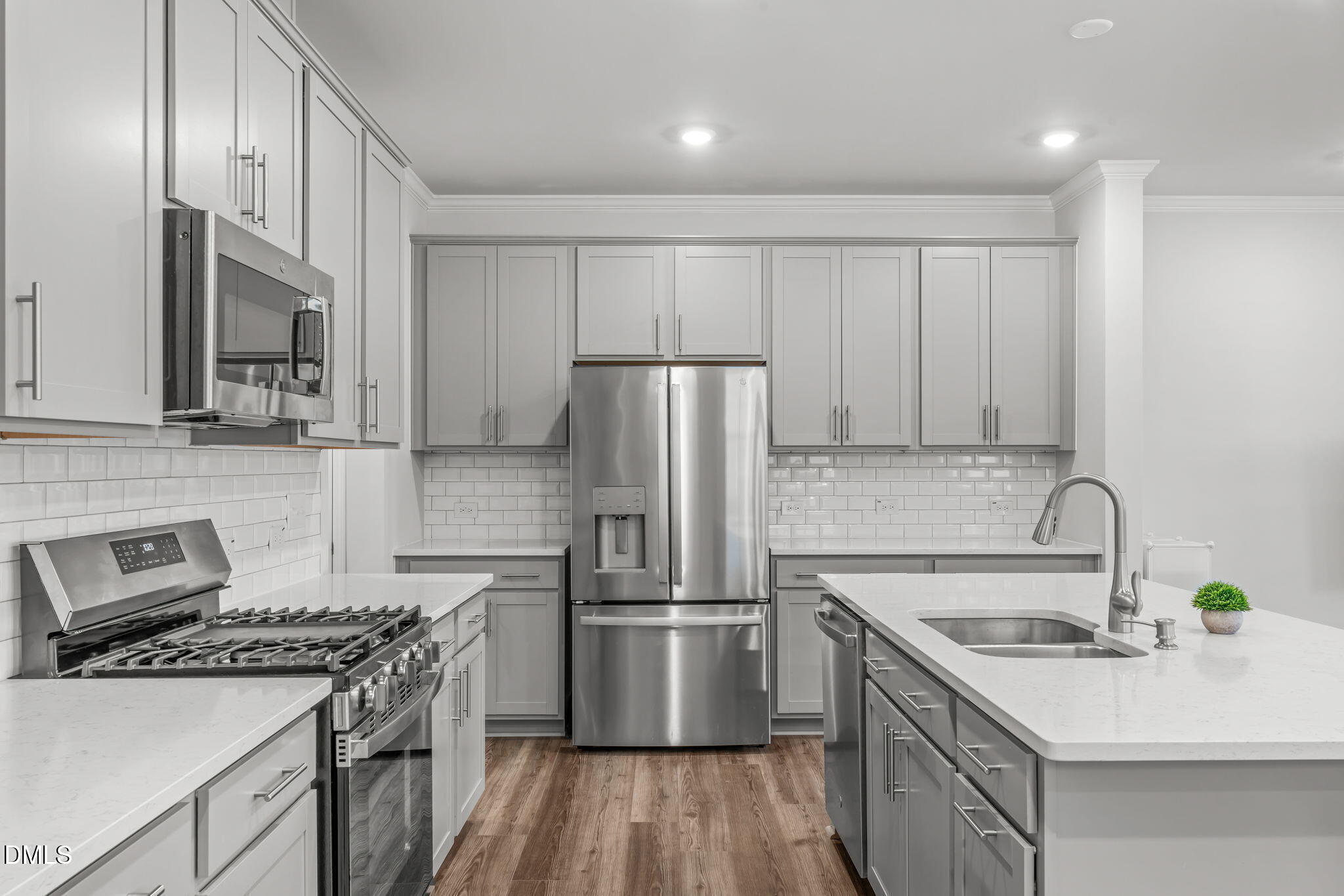 1809 Barrett Run Trail Apex, NC 27502 - Photo 5 of 23 a kitchen with a sink appliances and cabinets