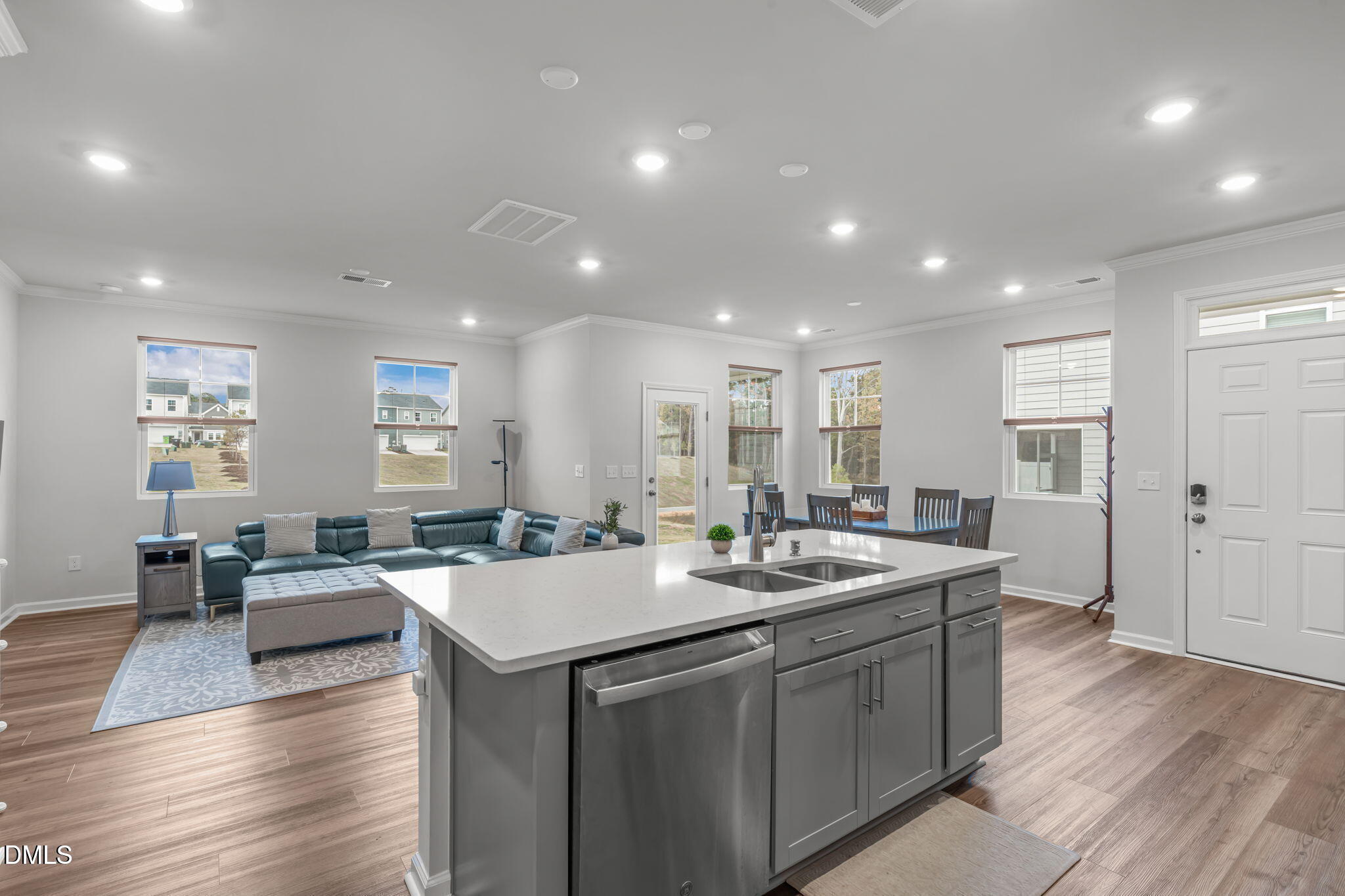 1809 Barrett Run Trail Apex, NC 27502 - Photo 9 of 23 a large kitchen with kitchen island a sink table and chairs